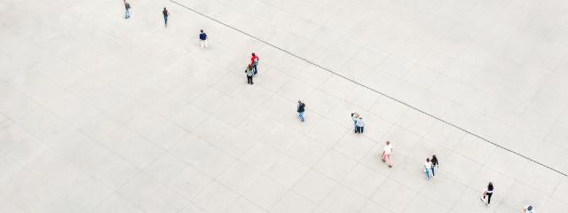 People in a line staying spaced apart