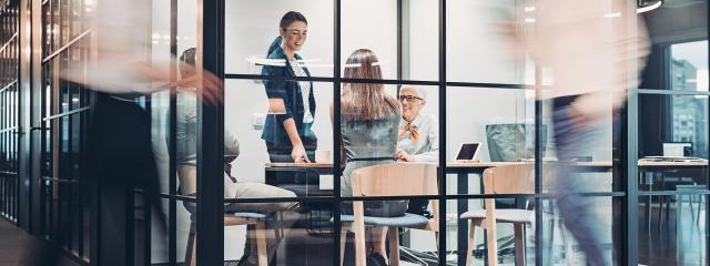 Office scene with meeting taking place