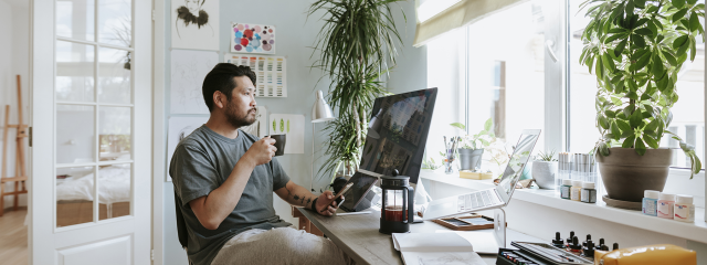 Man at desk looking out window